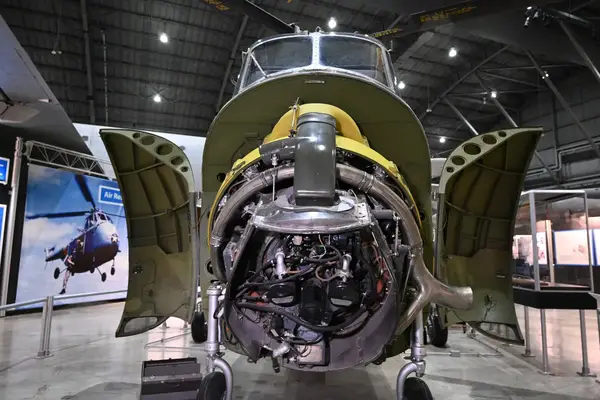 Aircraft engine display with open cowling at a museum exhibit