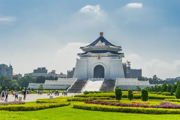 The Chiang Kaishek Memorial Hall in Taipei Taiwan with surrounding gardens and visitors
