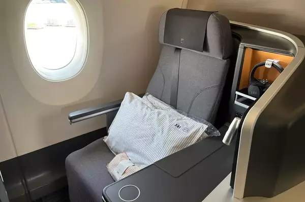 SAS business class seat layout with pillow and storage area