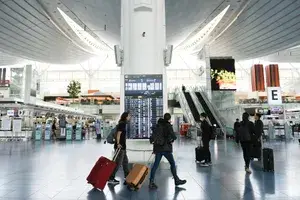 Travelers at a departure hall at Haneda Airport in Tokyo