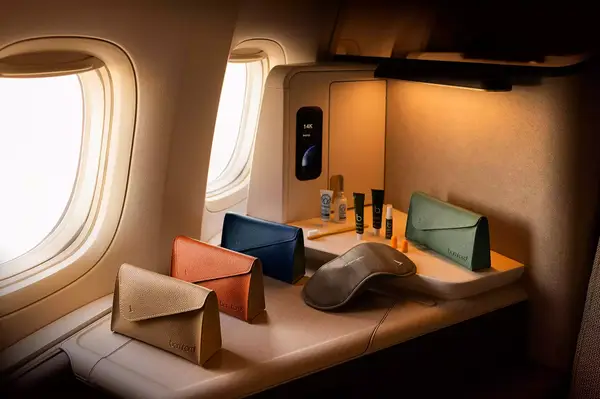 Cathay Pacific business class amenity kits arranged in an Aria Suite