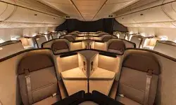Business class seats arranged in a luxurious layout in an airplane cabin