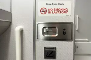 No smoking sign in an airplane bathroom 