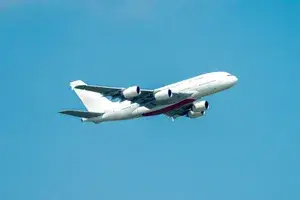 Commercial airplane in flight against a blue sky