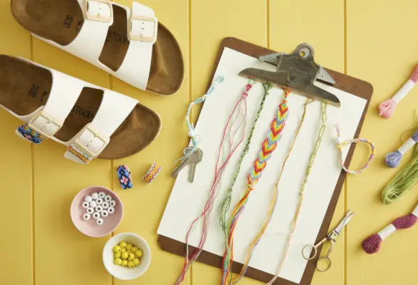 friendship bracelets on clip board