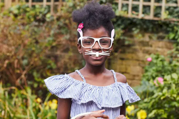 girl wearing easter bunny glasses