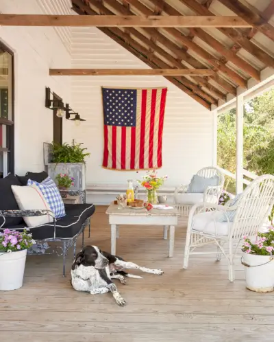 a dog relaxing outside saltbox hill country farmhouse in la grange, texas