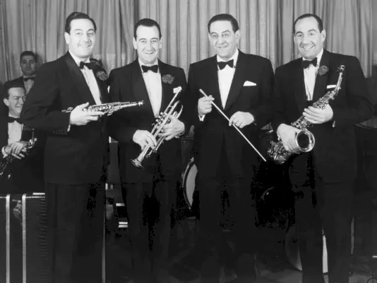 lombardo brothers who popularized auld lang syne, victor, lebert, guy, carmen with instruments, black and white vintage photo