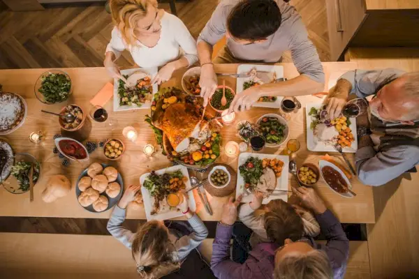 family seated around thanksgiving table