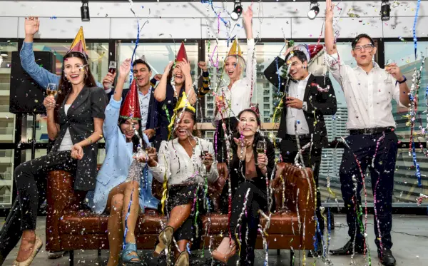 business men and women with glasses of champagne celebrating christmas and new year