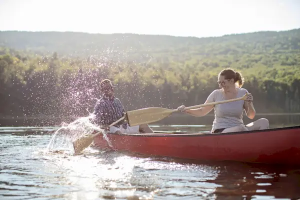 nature captions with couple in a canoe