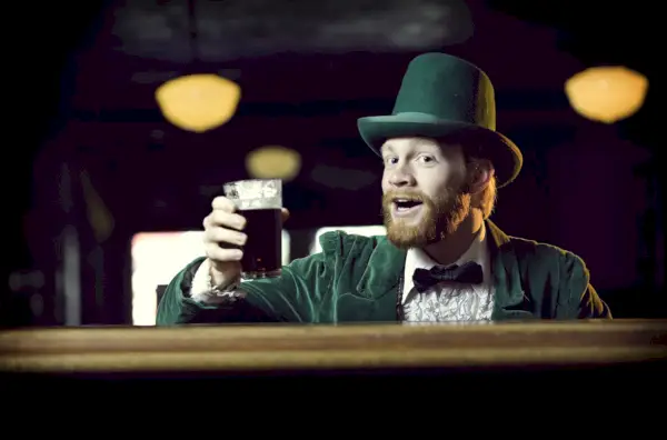 man dressed as leprechaun in pub