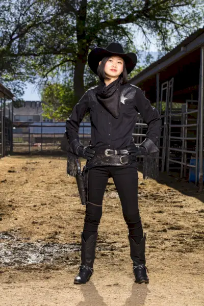 japanese woman in allblack cowgirl costume