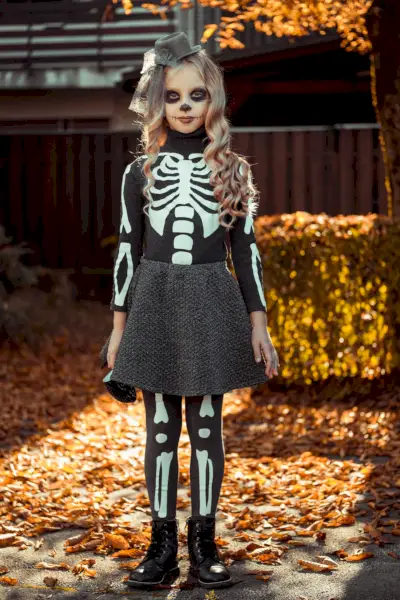 diy skeleton costume on boy in pumpkin patch