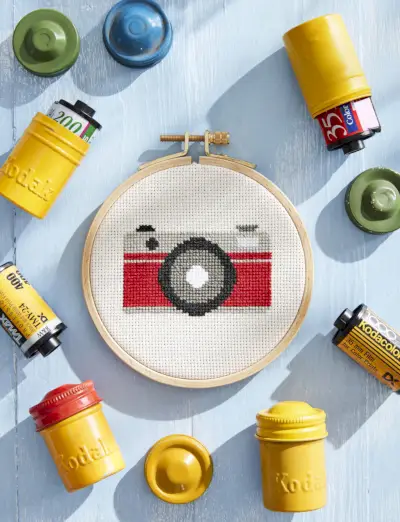 cross-stitch camera with vintage film containers