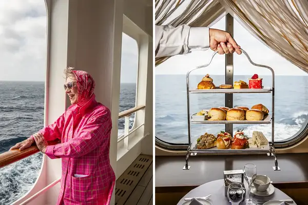 A person enjoying the view from a ship railing alongside a threetiered tea and pastry setup by a window on an ocean liner