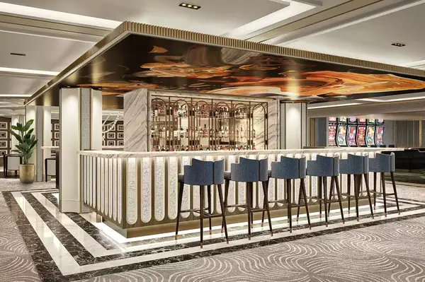 Elegant bar counter with stools in a modern atrium setting