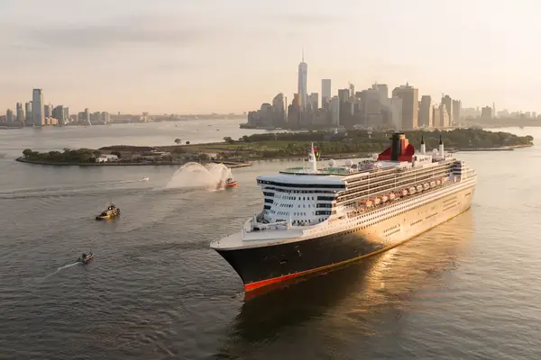 The Queen Mary 2 cruise ship sailing past New York City, just south of Governors Island.