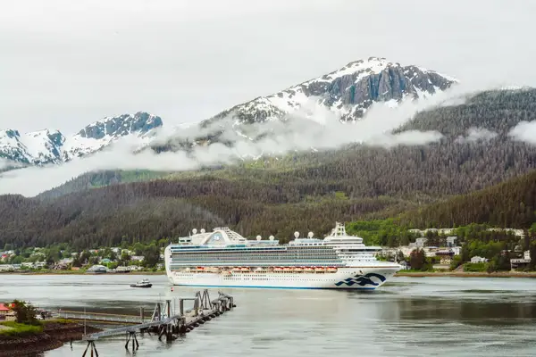 A large princess cruise ship in front of mountains in Alaska