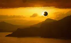 A solar eclipse over a coastal landscape with sea and mountains
