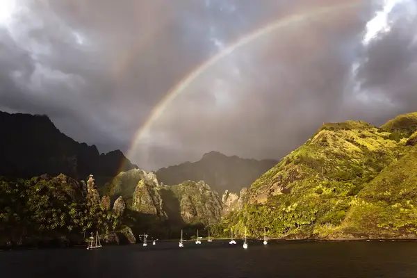 A group of ships in a bay in Tahiti.