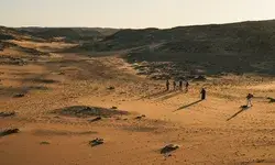 Tourists walking in a desert in Egypt