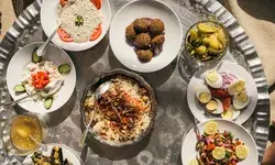 Traditional Egyptian dishes on plates on a small round table