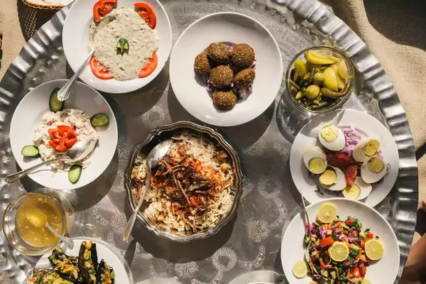 Traditional Egyptian dishes on plates on a small round table