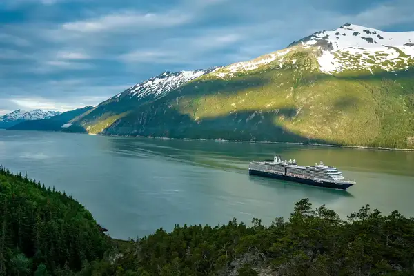 Nieuw Amsterdam sailing by mountains
