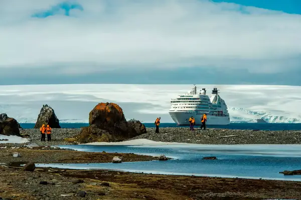 Cruise ship Seabourn Quest at the Polish research station Arctowski on King George Island in the South Shetland Island group, Antarctica with passengers.