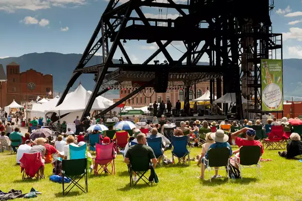People listen to a concert at the Montana Folk Festival