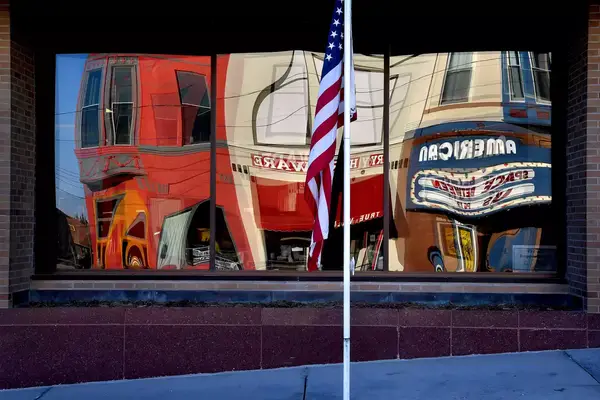Reflections in a window on a street in Corning, Iowa