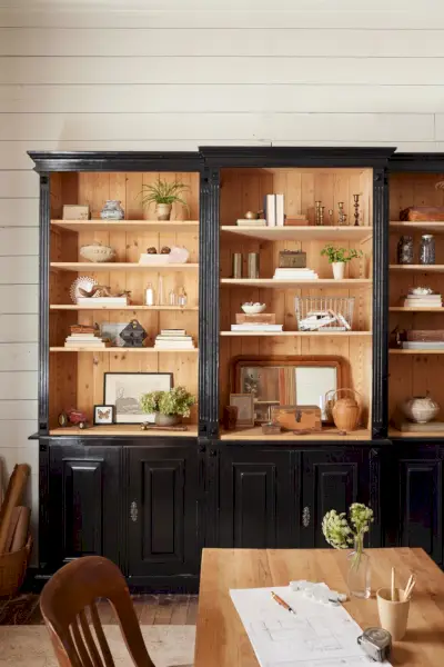 a bookcase painted in high gloss black finish