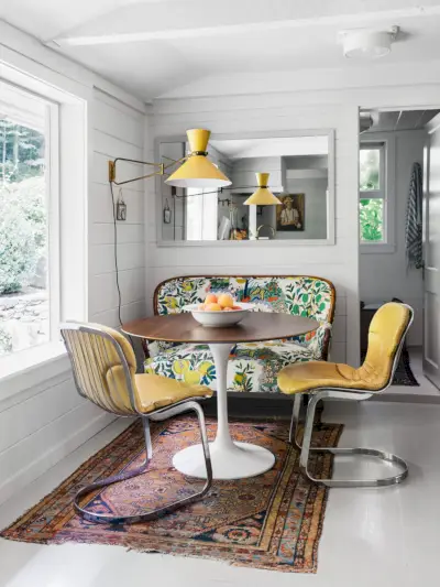 breakfast nook with white shiplap and midcentury modern furniture