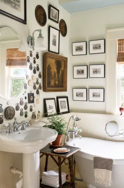bathroom with antique wood linen closet and white clawfoot tub