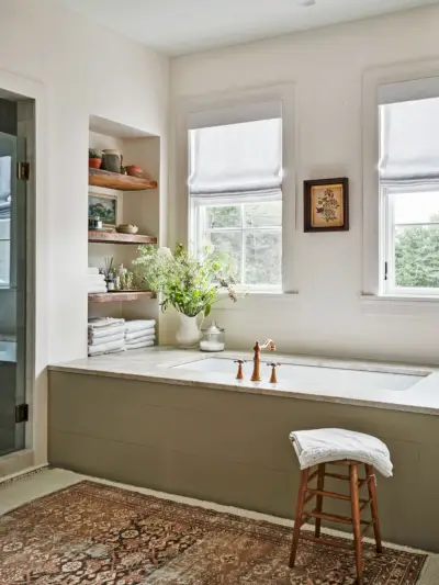 bathroom with light green paneling