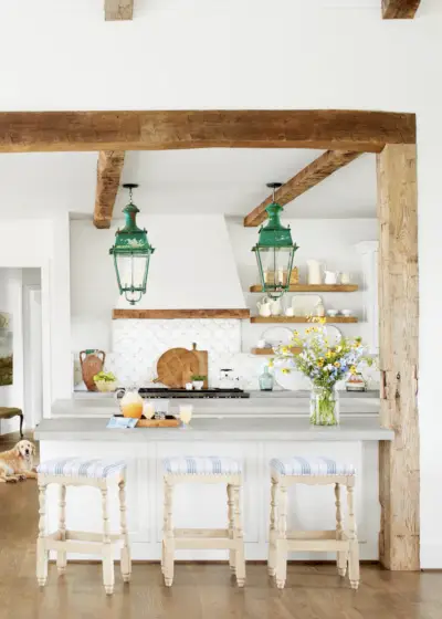 sprawling white modern farmhouse with wood door
