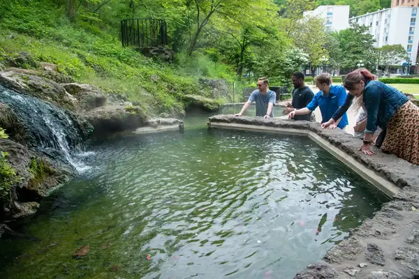 Group of people by a hot spring