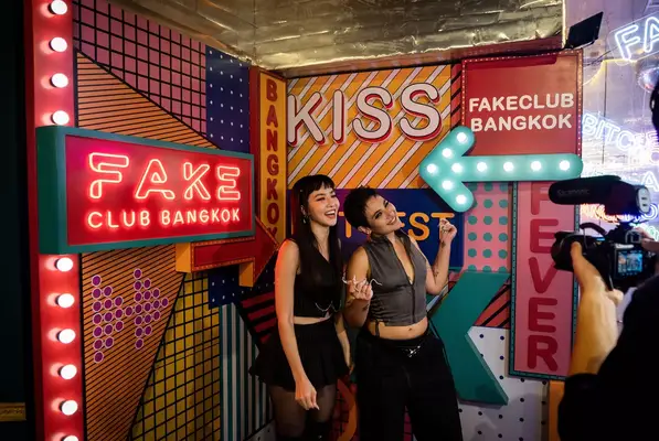 Two people outside of a club in Bangkok