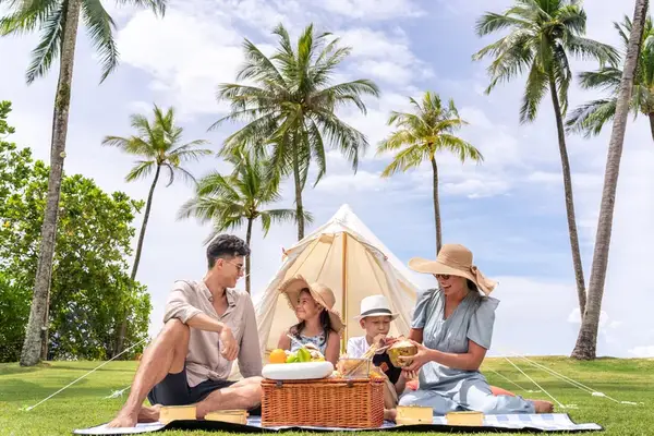 A family having a picnic at a resort in Thailand