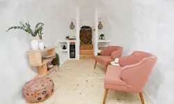 Interior of the Big Idaho Potato Hotel with two armchairs and a rustic decor style