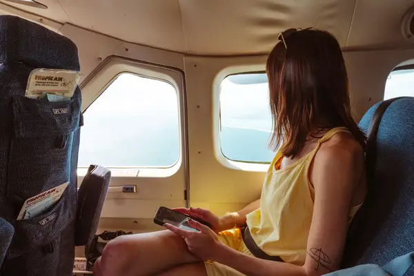A woman sitting on a plane
