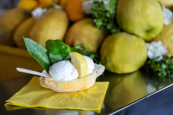 Lemon sorbet served in a half of a frozen lemon