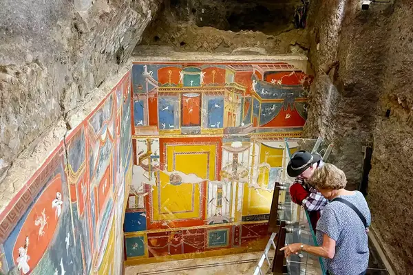 Tourists look and ruins in Italy