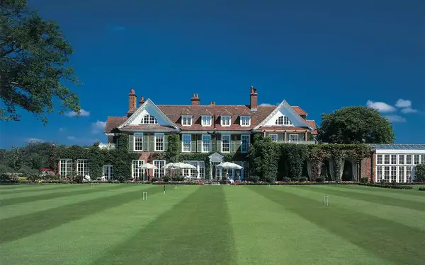 View of ivy-covered Chewton Glen from the front lawn.