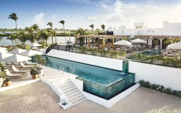 Infinity pool and lounge chairs at Belmond Cap Juluca, Anguilla.