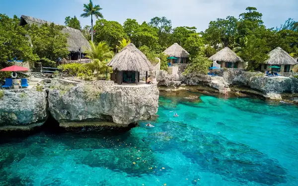 Cliff-top villas and a blue lagoon at Rockhouse Resort & Spa, Jamaica.