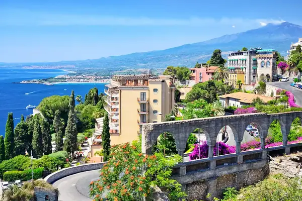 Taormina town with Mount Etna on background