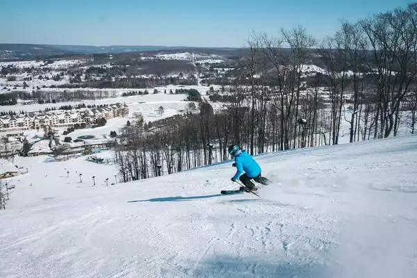 A person skiing down a hill
