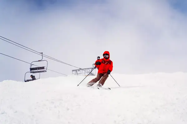 A skier under the ski lift